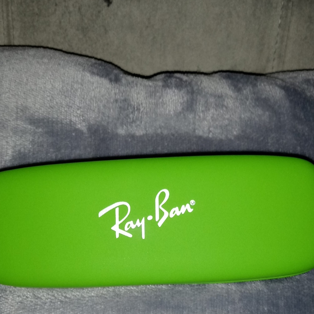 Kids purple and pink Ray Ban frames with green cas